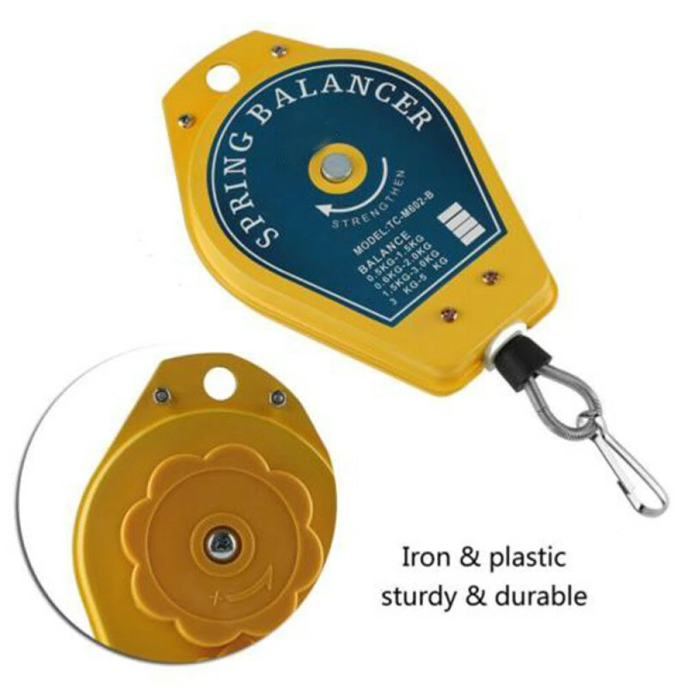 Detalle del equilibrador de muelle para destornillador eléctrico en taller